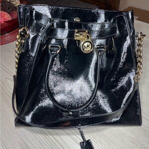 Michael Kors Hamilton Lock Tote in black patent leather with gold-tone hardware